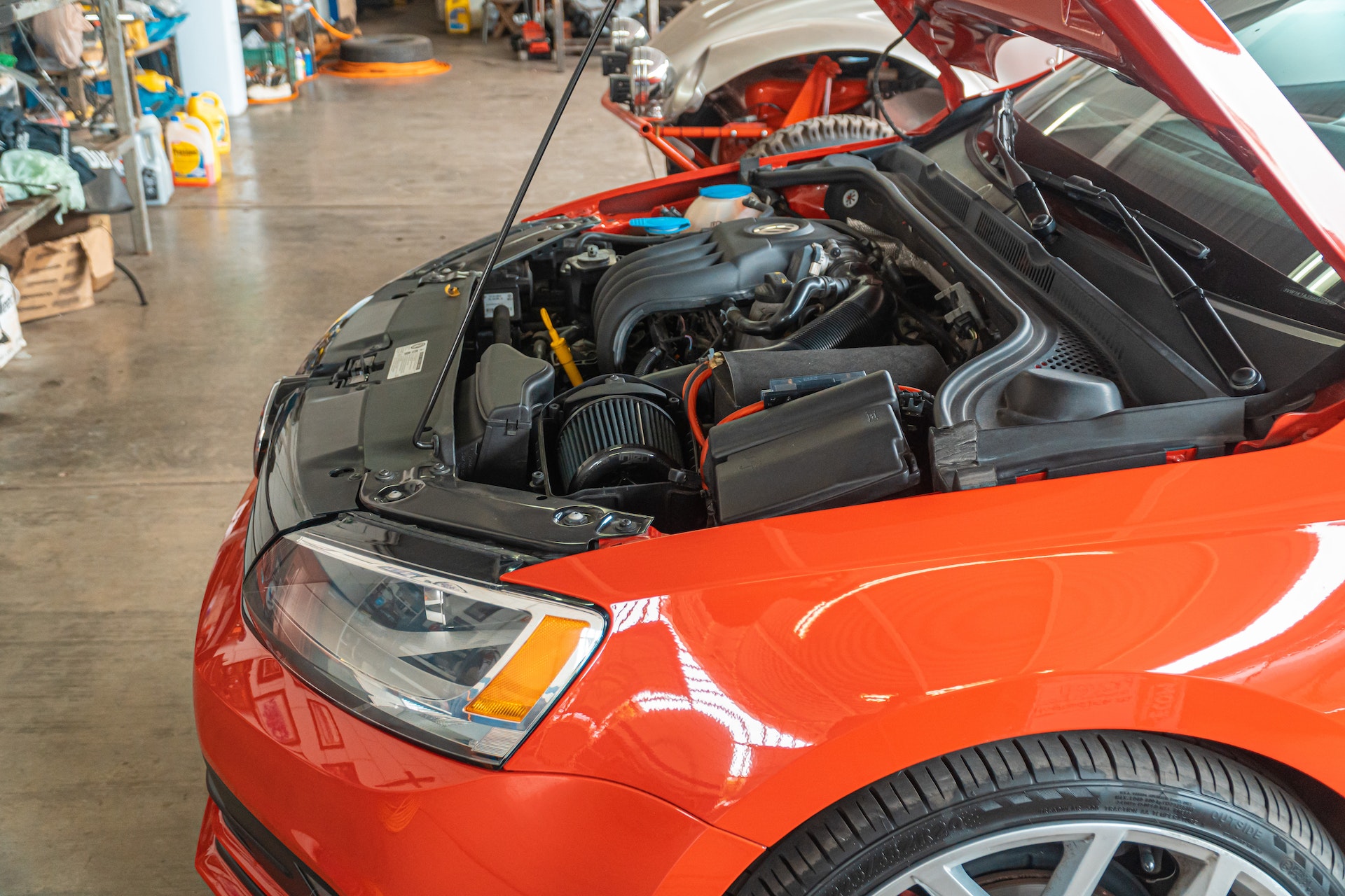 Dead Battery in the Georgia Heat: What To Do When Your Car Won't Start in Forest Park 5 Maintenance on red vehicle | New Image Towing
