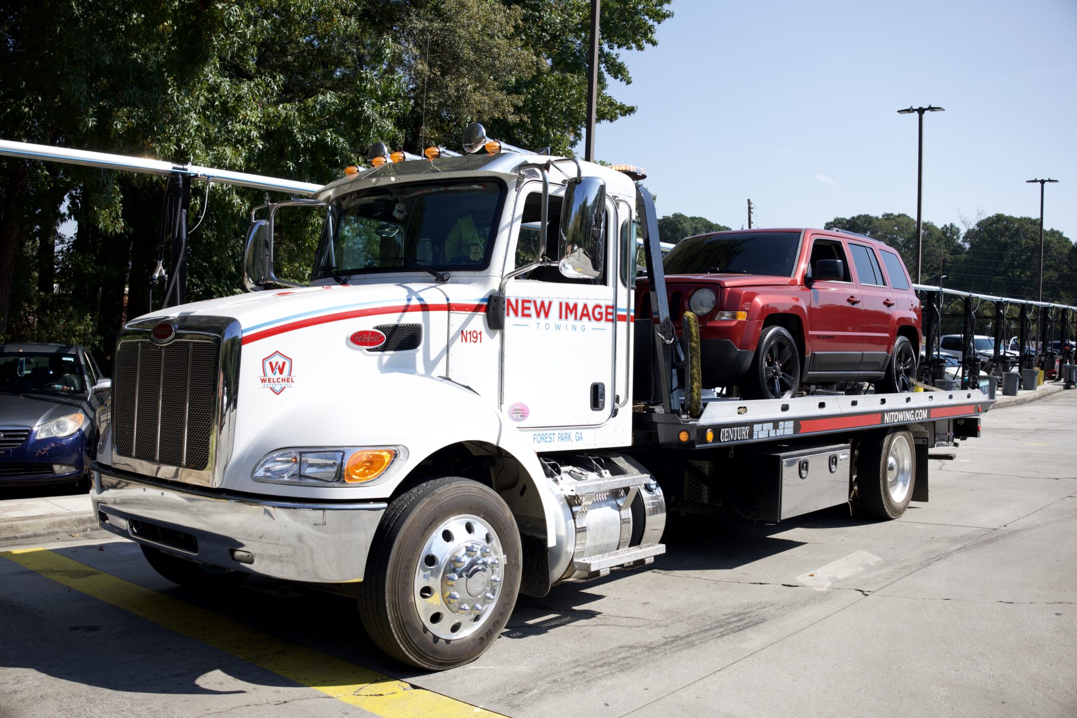 Car Lockout Service in Forest Park, GA: What Happens When You Call for Help 3 New Image truck towing red van, Car Lockout Service in Forest Park, GA