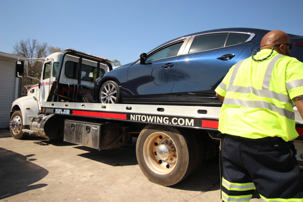 Flat bed truck towing vehicle | New Image Towing